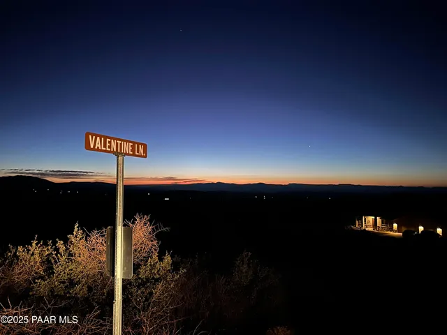 a kitchen with stainless steel appliances a sink stove and cabinets
