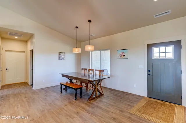 a bathroom with a sink vanity mirror bathtub and toilet