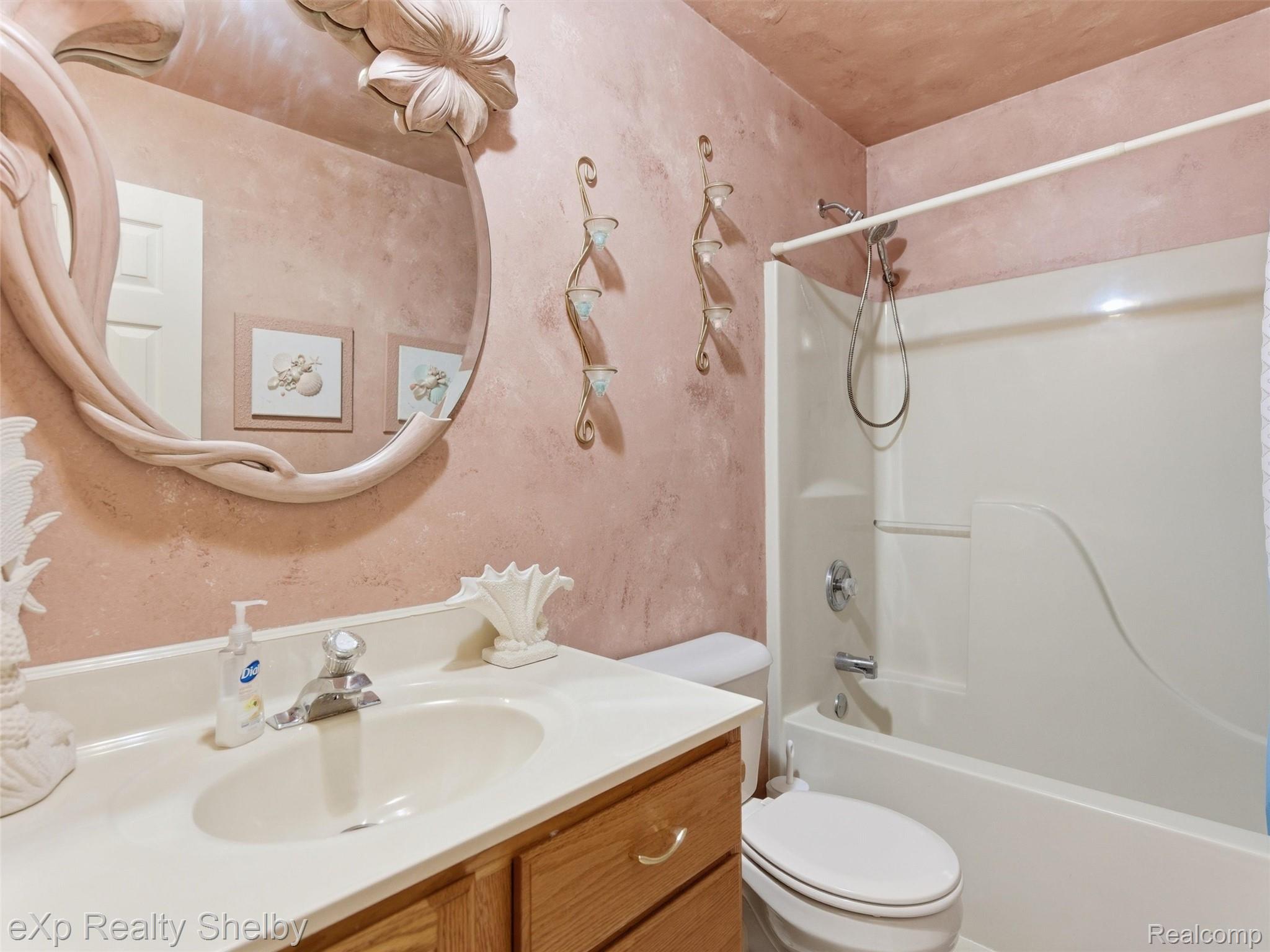 4154 Union Street Dryden, MI 48428 - Photo 17 of 41 Bathroom featuring a single vanity with wood cabinetry, a built-in sink, and a chrome faucet