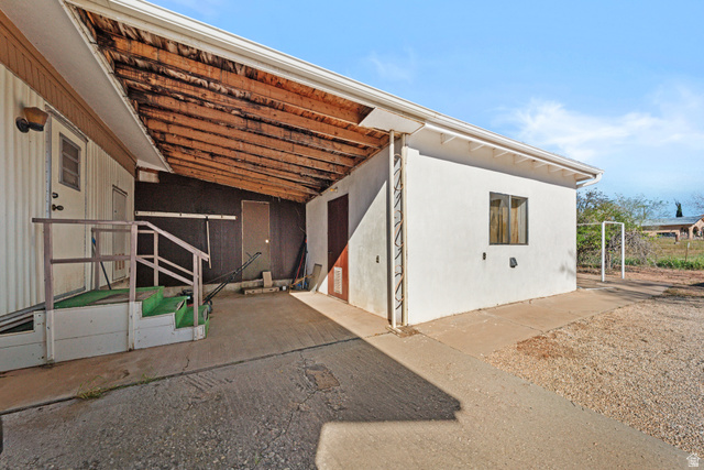 49 600 North Hurricane, UT 84737 - Photo 24 of 33 Back of house featuring stucco siding