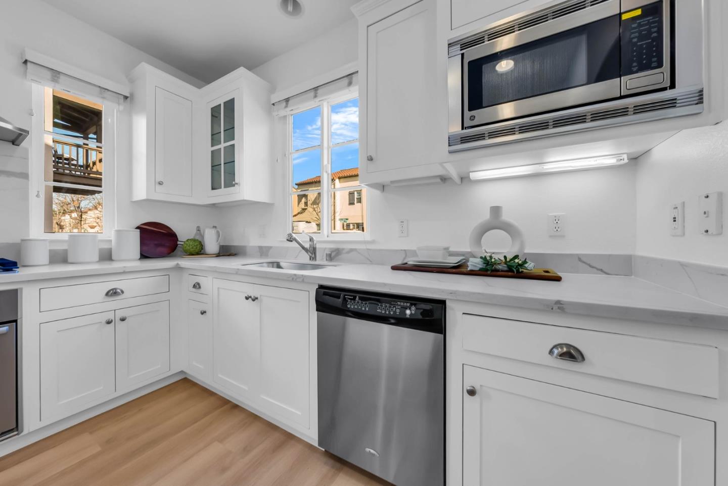 503 Palo Verde Common Fremont, CA 94539 - Photo 14 of 38 a kitchen with cabinets stainless steel appliances and wooden floor