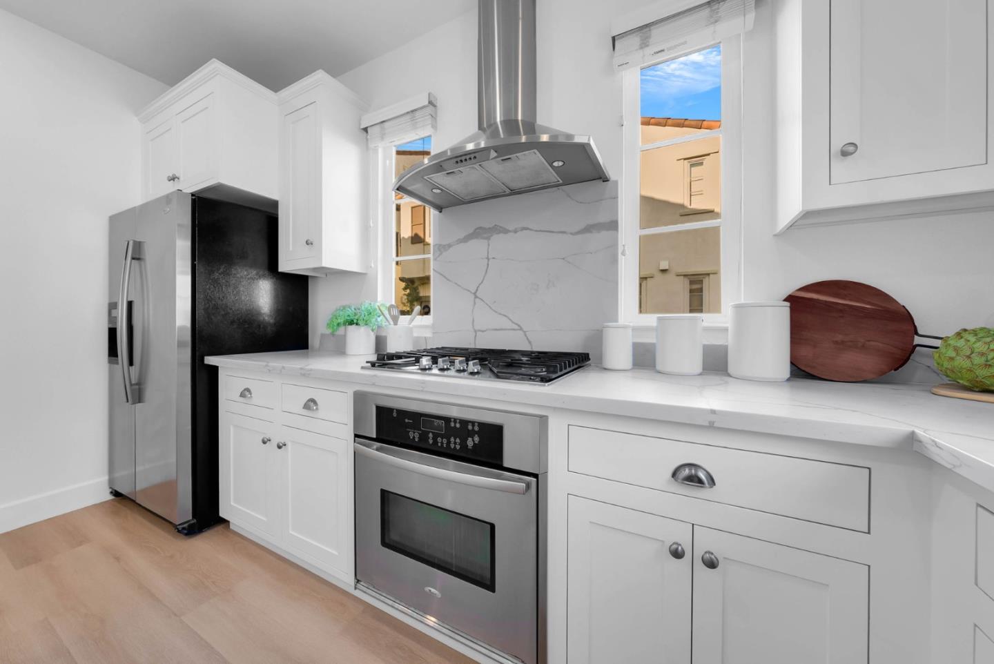 503 Palo Verde Common Fremont, CA 94539 - Photo 15 of 38 a kitchen with stainless steel appliances granite countertop a stove and a refrigerator