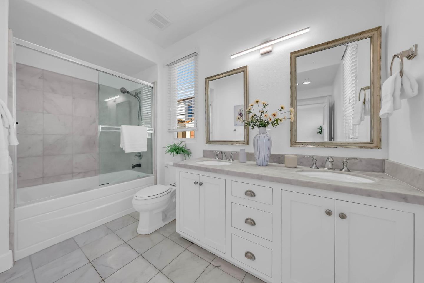 503 Palo Verde Common Fremont, CA 94539 - Photo 23 of 38 a bathroom with a granite countertop toilet a sink and a bathtub