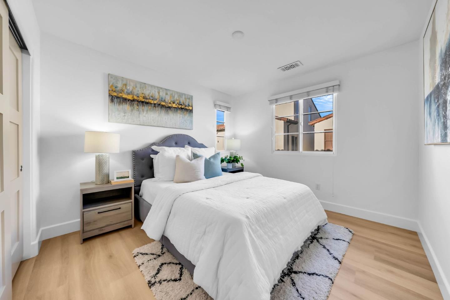 503 Palo Verde Common Fremont, CA 94539 - Photo 24 of 38 a bedroom with a bed and wooden floor