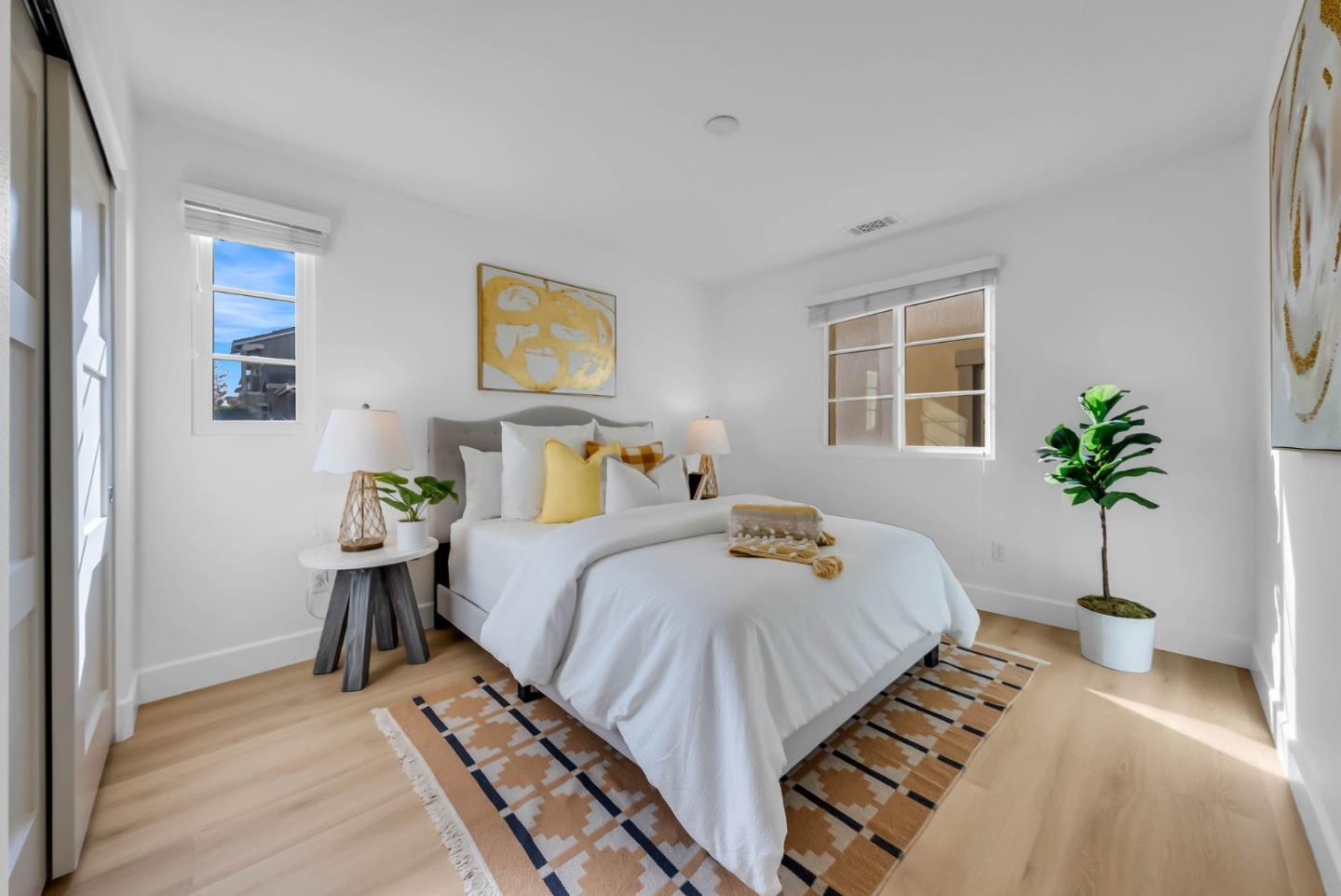 503 Palo Verde Common Fremont, CA 94539 - Photo 25 of 38 a bedroom with a bed and a potted plant