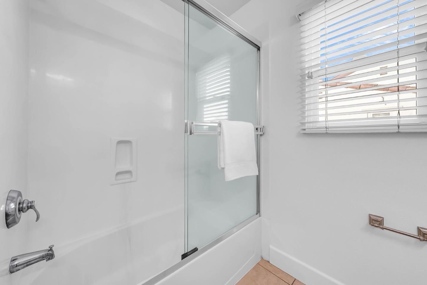 503 Palo Verde Common Fremont, CA 94539 - Photo 28 of 38 a bathroom with a bathtub a shower and a window