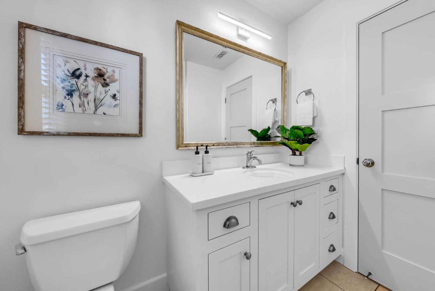503 Palo Verde Common Fremont, CA 94539 - Photo 29 of 38 a bathroom with a sink a toilet and a large mirror