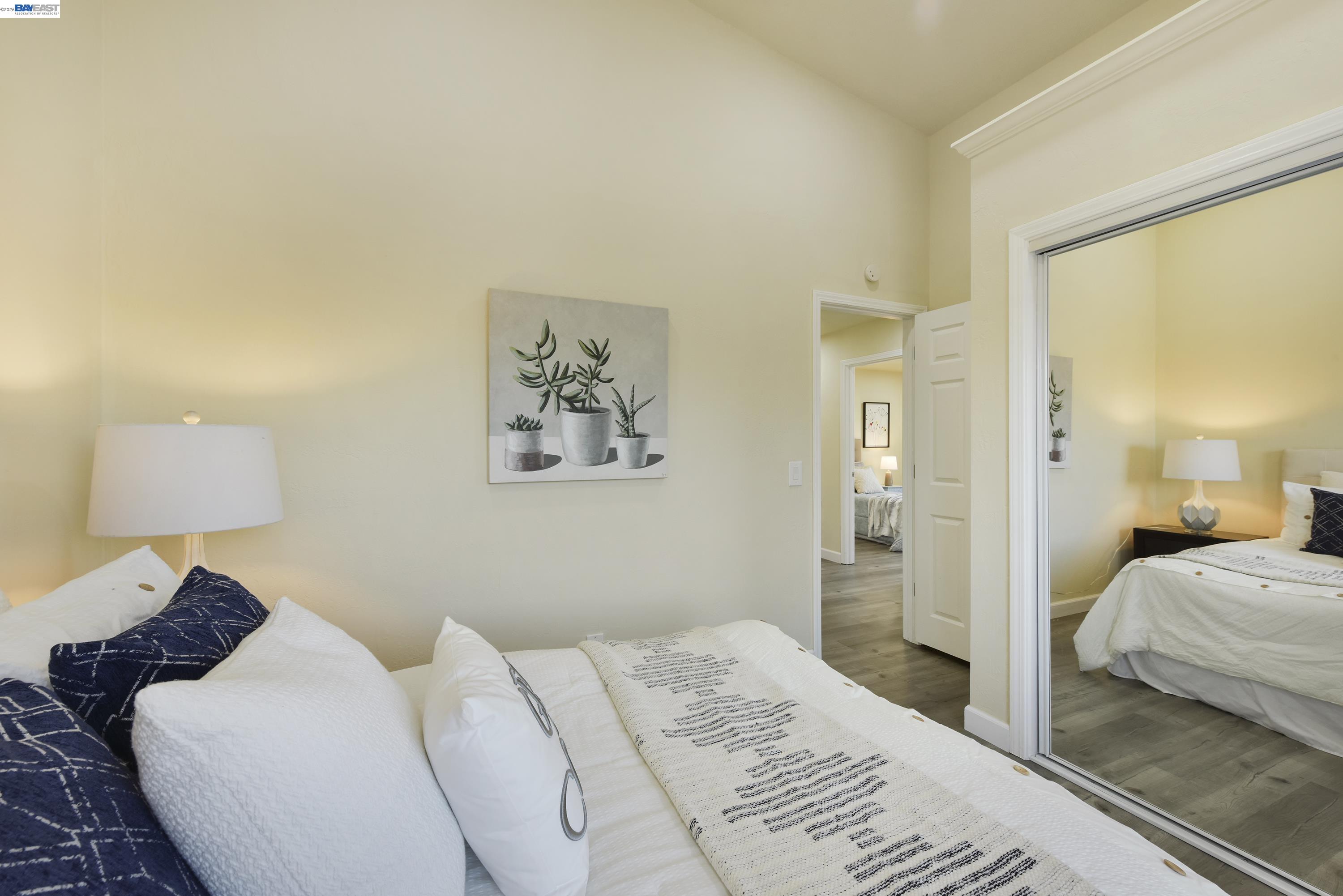 20 Yale Court San Ramon, CA 94583 - Photo 11 of 27 a bedroom with a bed and a lamp