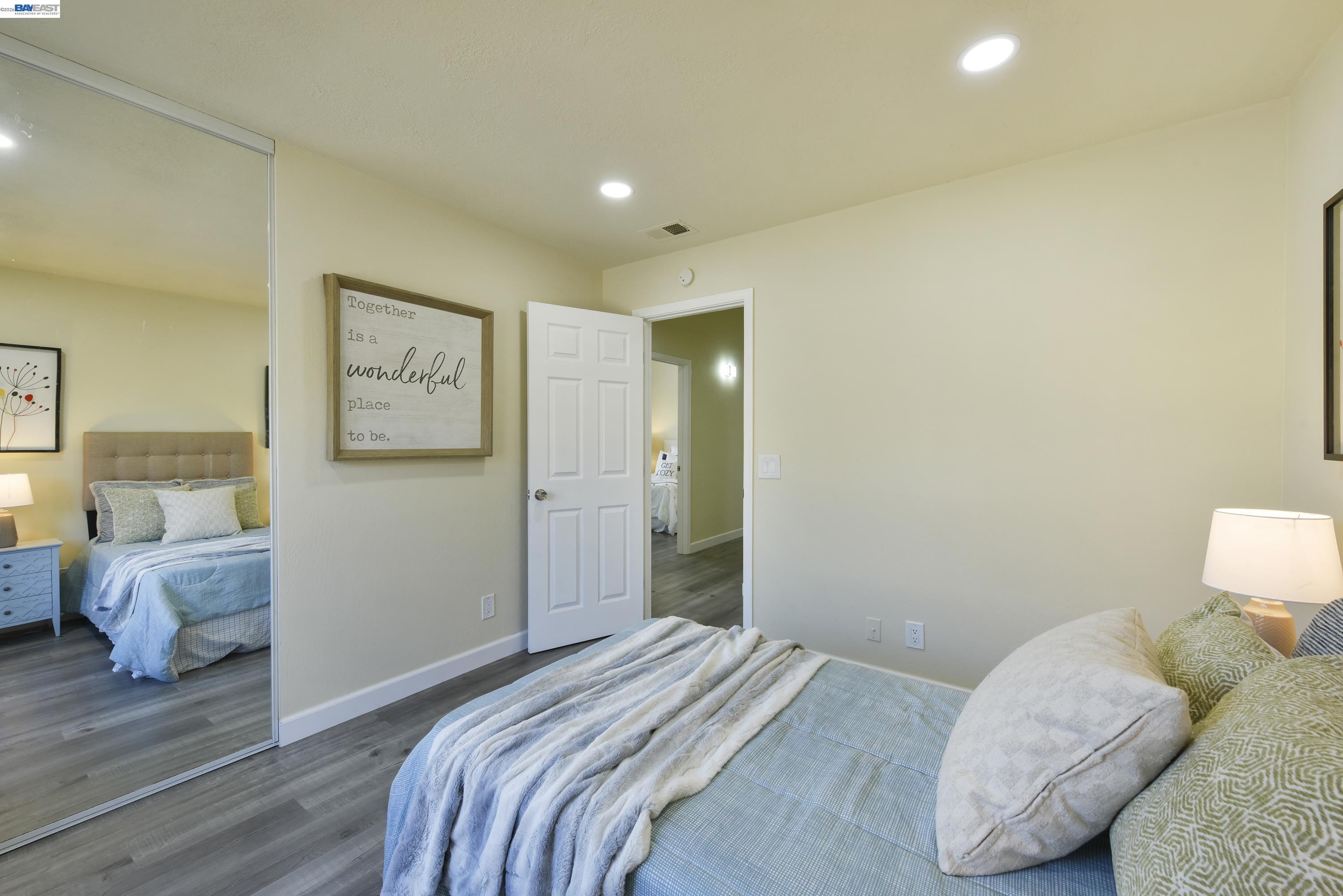 20 Yale Court San Ramon, CA 94583 - Photo 12 of 27 a bedroom with a bed and wooden floor