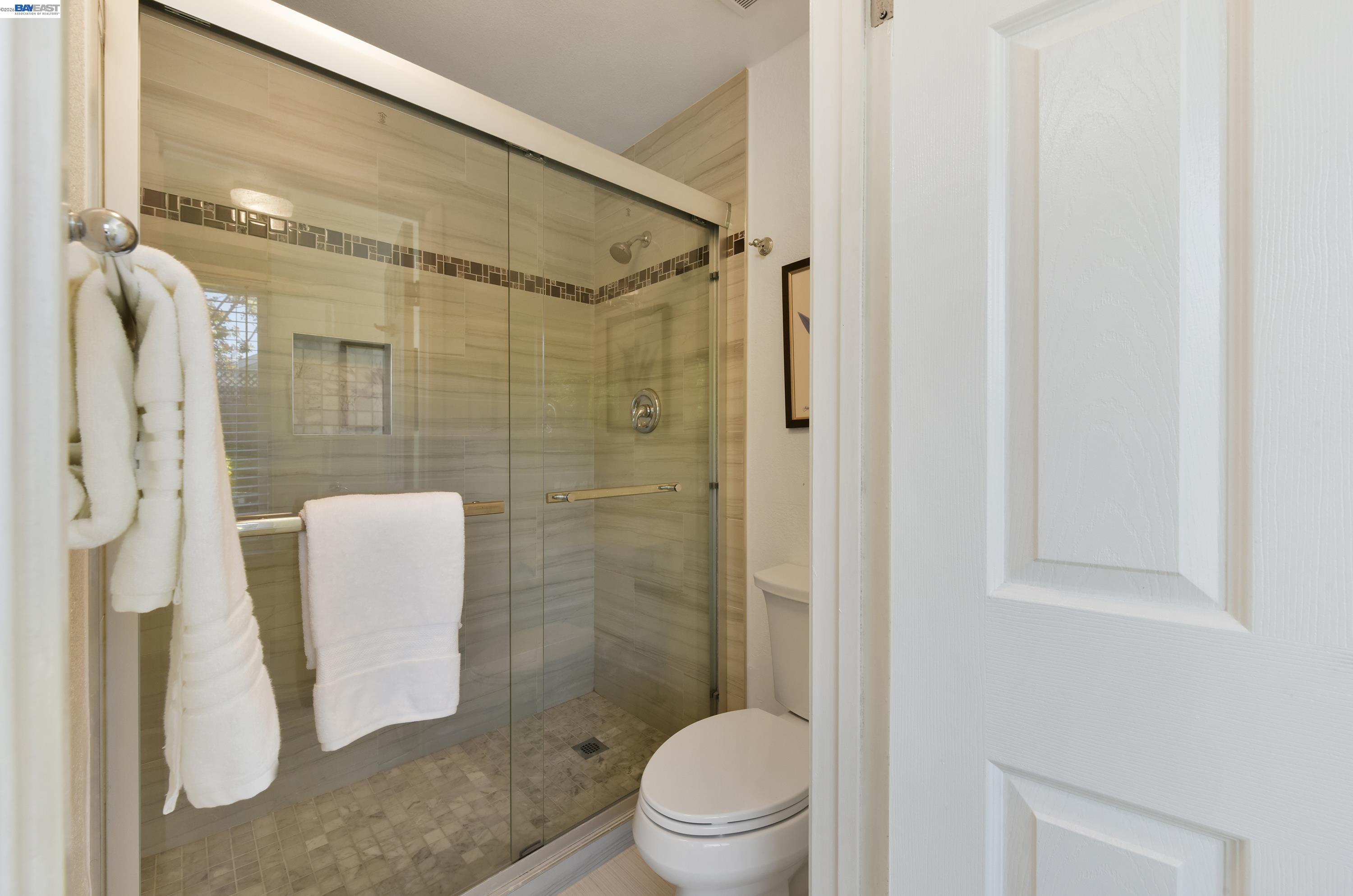 20 Yale Court San Ramon, CA 94583 - Photo 18 of 27 a bathroom with a shower and a toilet