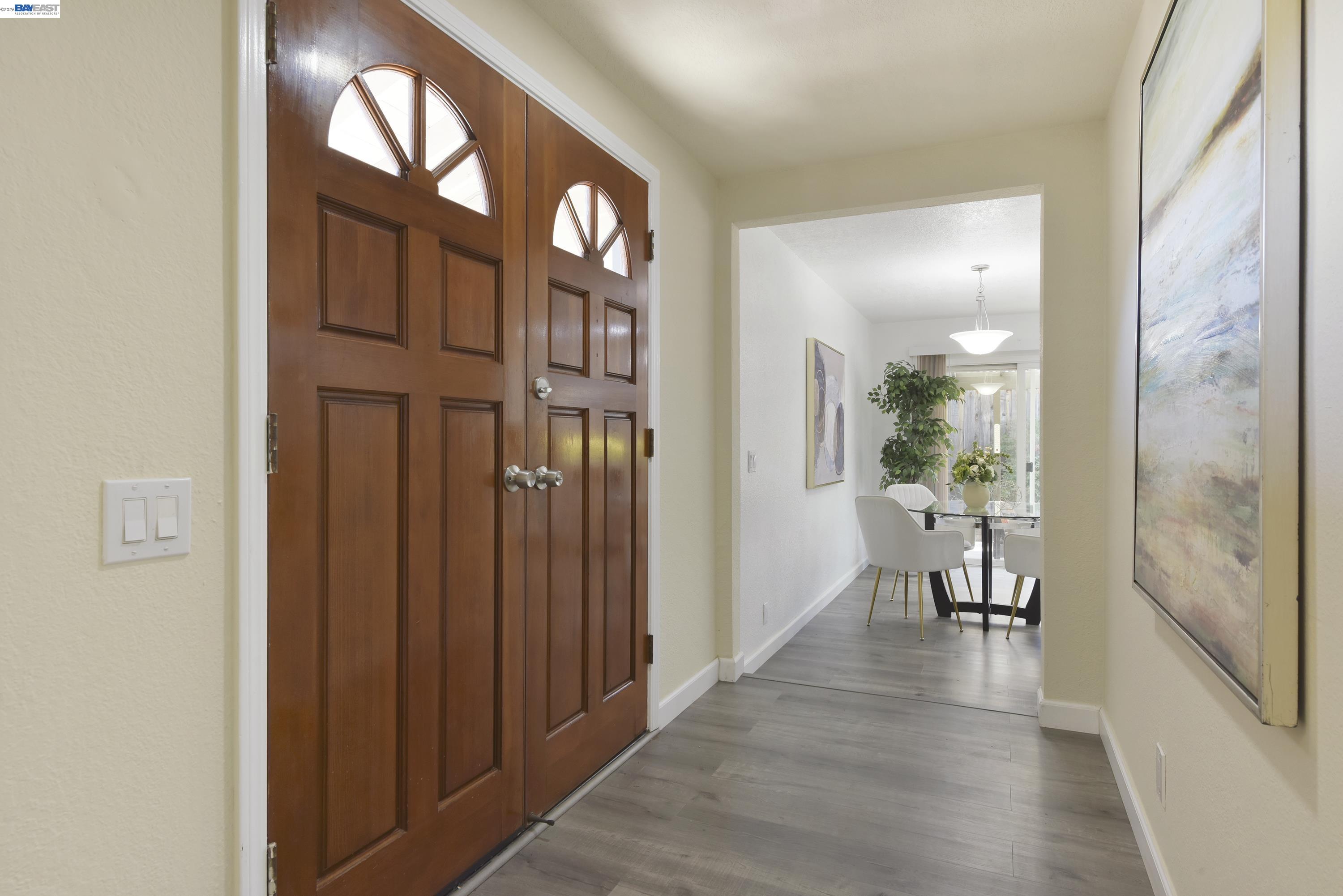 20 Yale Court San Ramon, CA 94583 - Photo 20 of 27 wooden floor in a hall with a dining table & chairs in a room