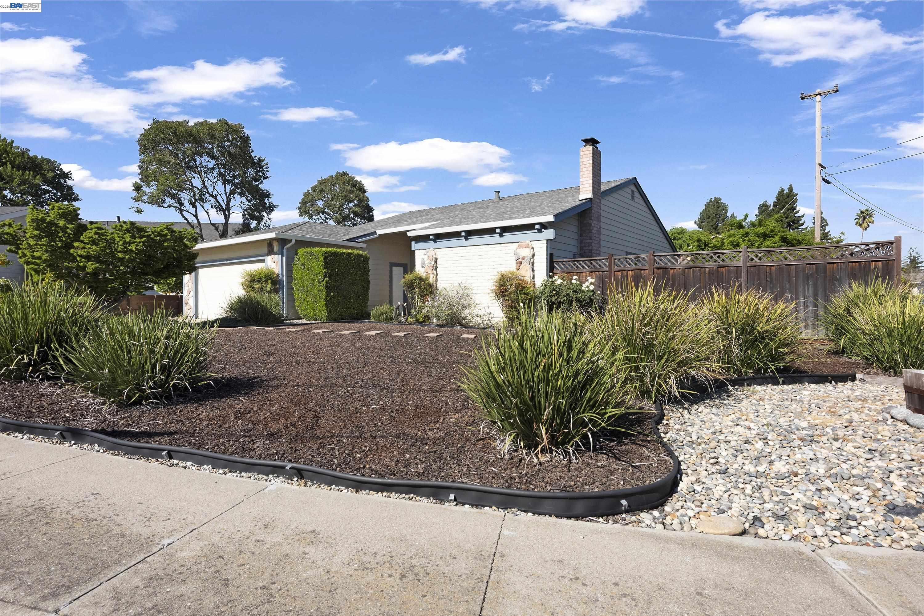 20 Yale Court San Ramon, CA 94583 - Photo 22 of 27 a front view of a house with a yard and potted plants