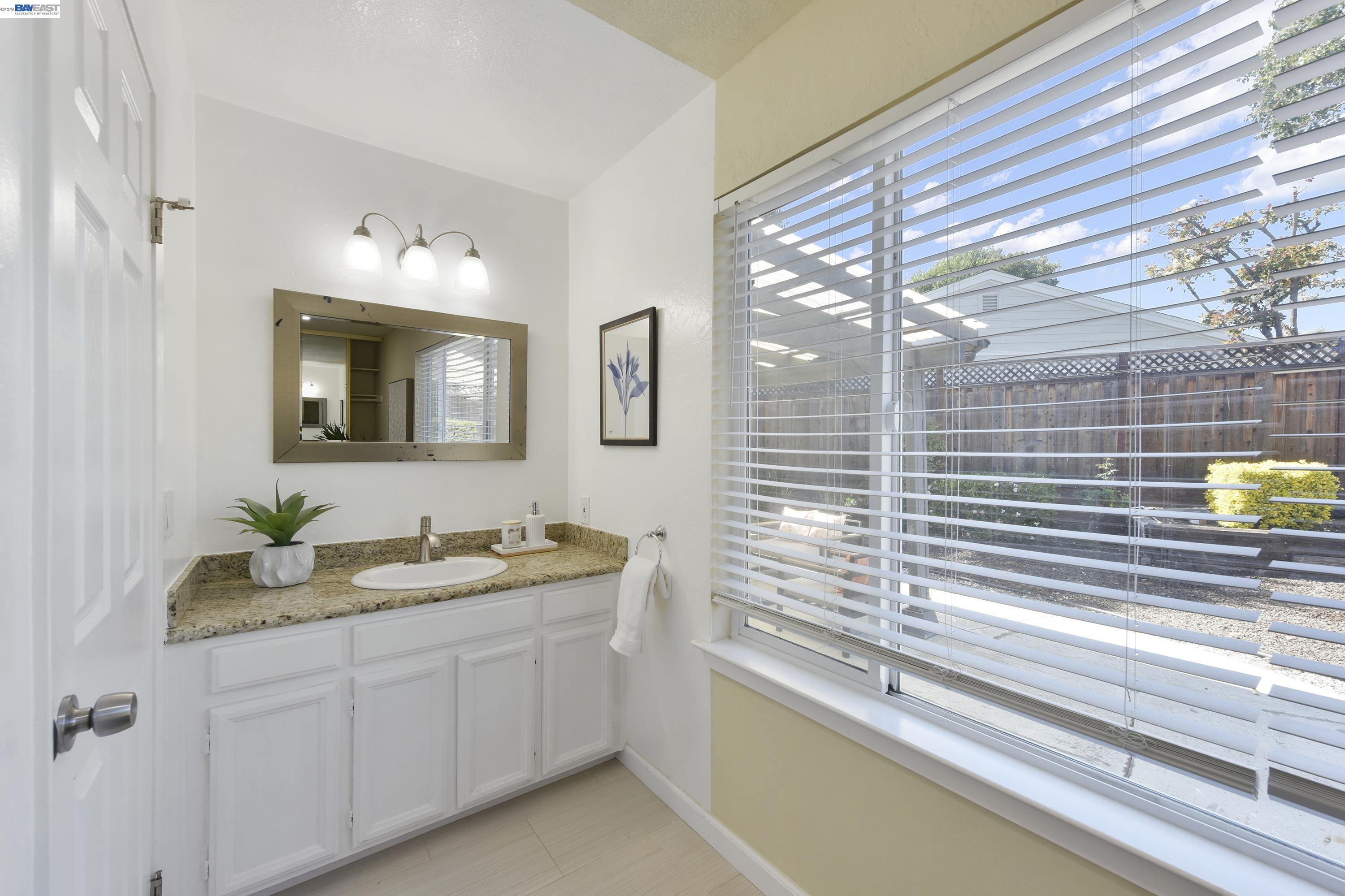 20 Yale Court San Ramon, CA 94583 - Photo 8 of 27 a bathroom with a double vanity sink and a mirror
