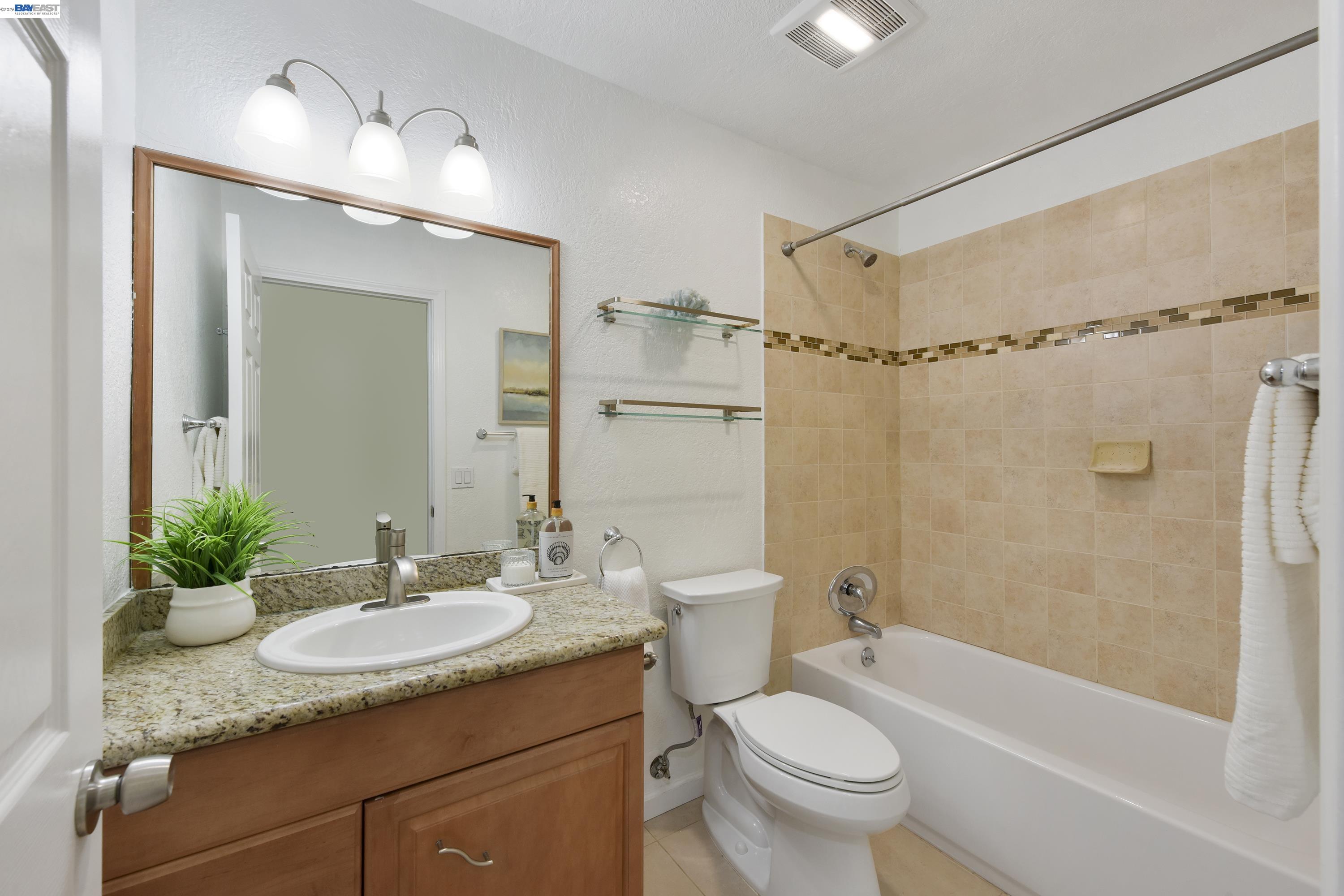 20 Yale Court San Ramon, CA 94583 - Photo 9 of 27 a bathroom with a granite countertop sink toilet and shower
