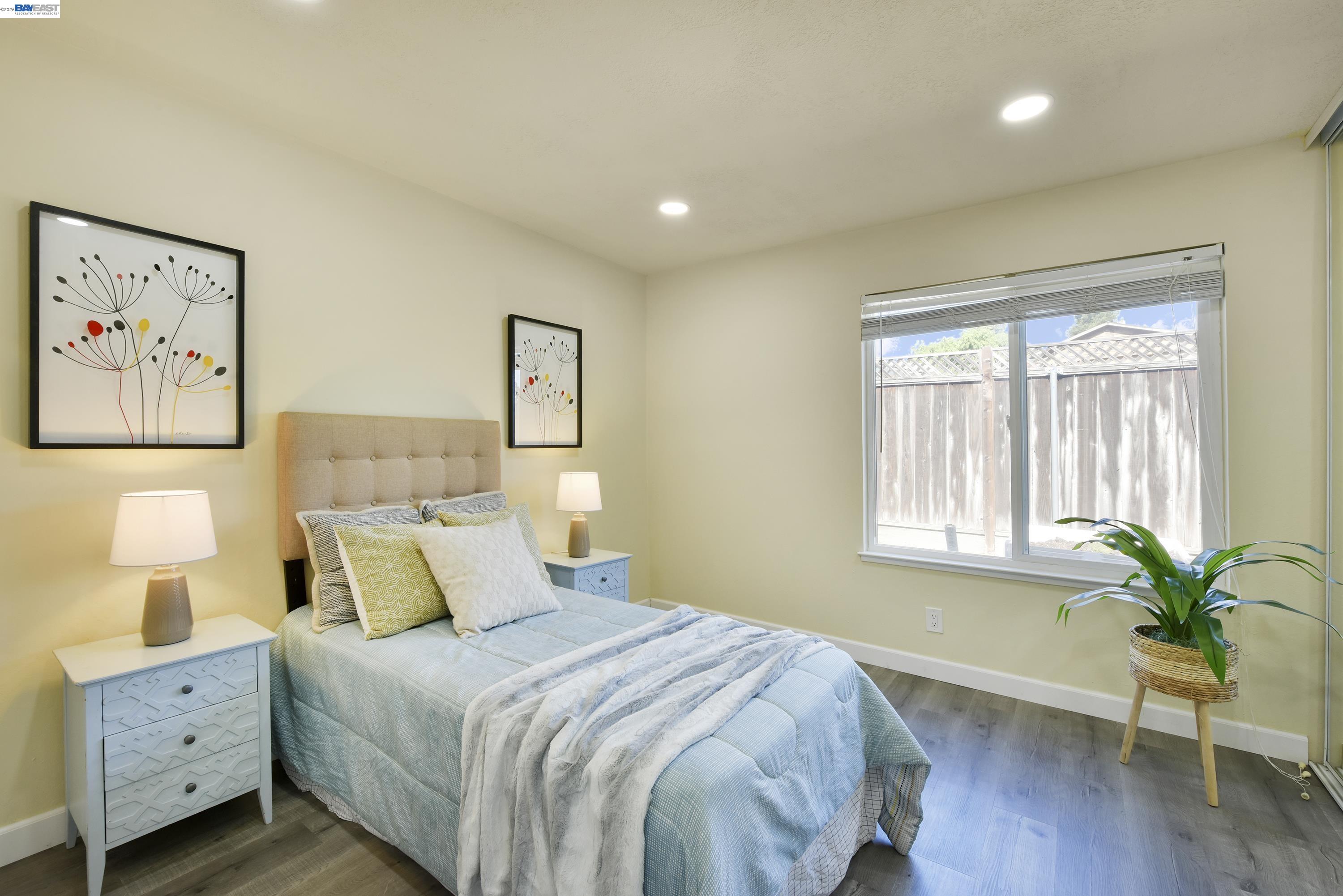 20 Yale Court San Ramon, CA 94583 - Photo 10 of 27 a bedroom with a bed and painting on the wall