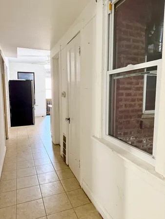 a view of a closet from a hallway
