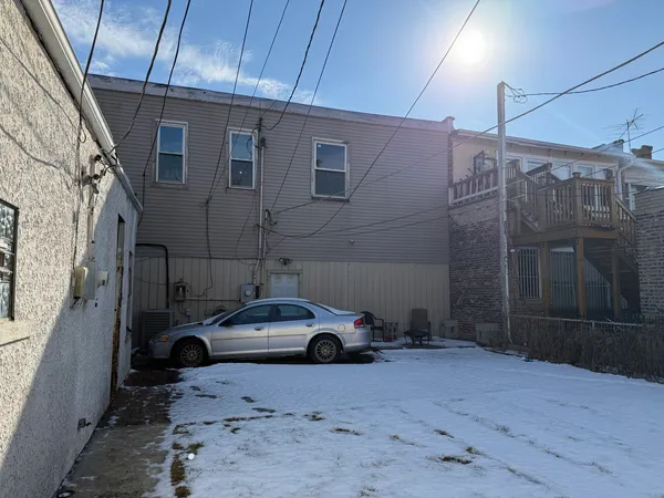 a car parked in front of a house