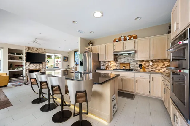a kitchen with refrigerator cabinets and a counter top space