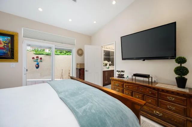 a bathroom with a double vanity sink mirror and shower