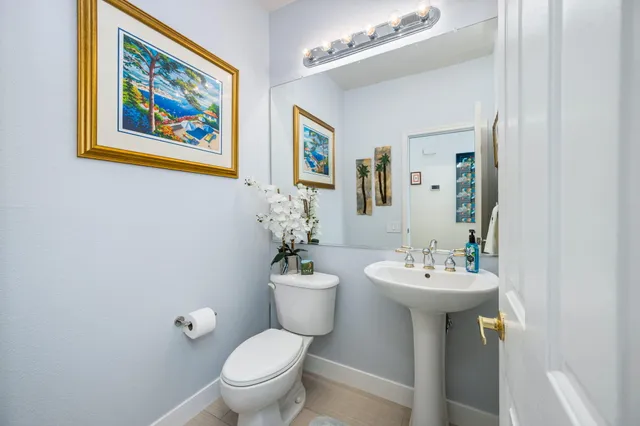 a view of a patio with couches chairs and a potted plant