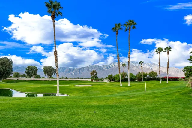 a view of a house with backyard porch and sitting area