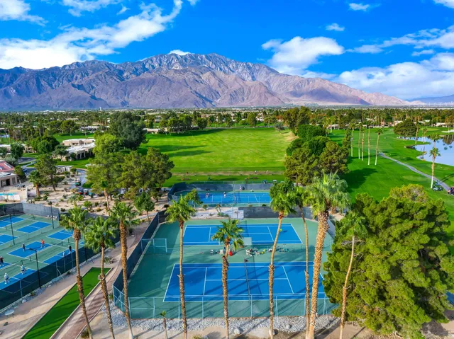 a view of a fountain with a yard