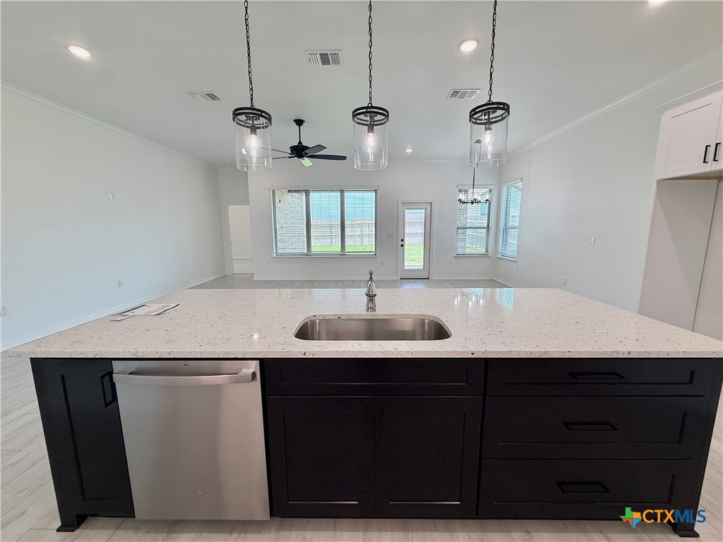 2016 Yarrow Road Temple, TX 76502 - Photo 7 of 30 a kitchen with a sink a mirror and wooden floor