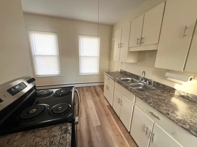 a kitchen with a stove and a sink