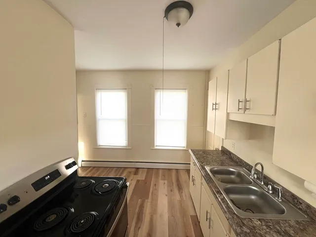 a bathroom with a sink and a window