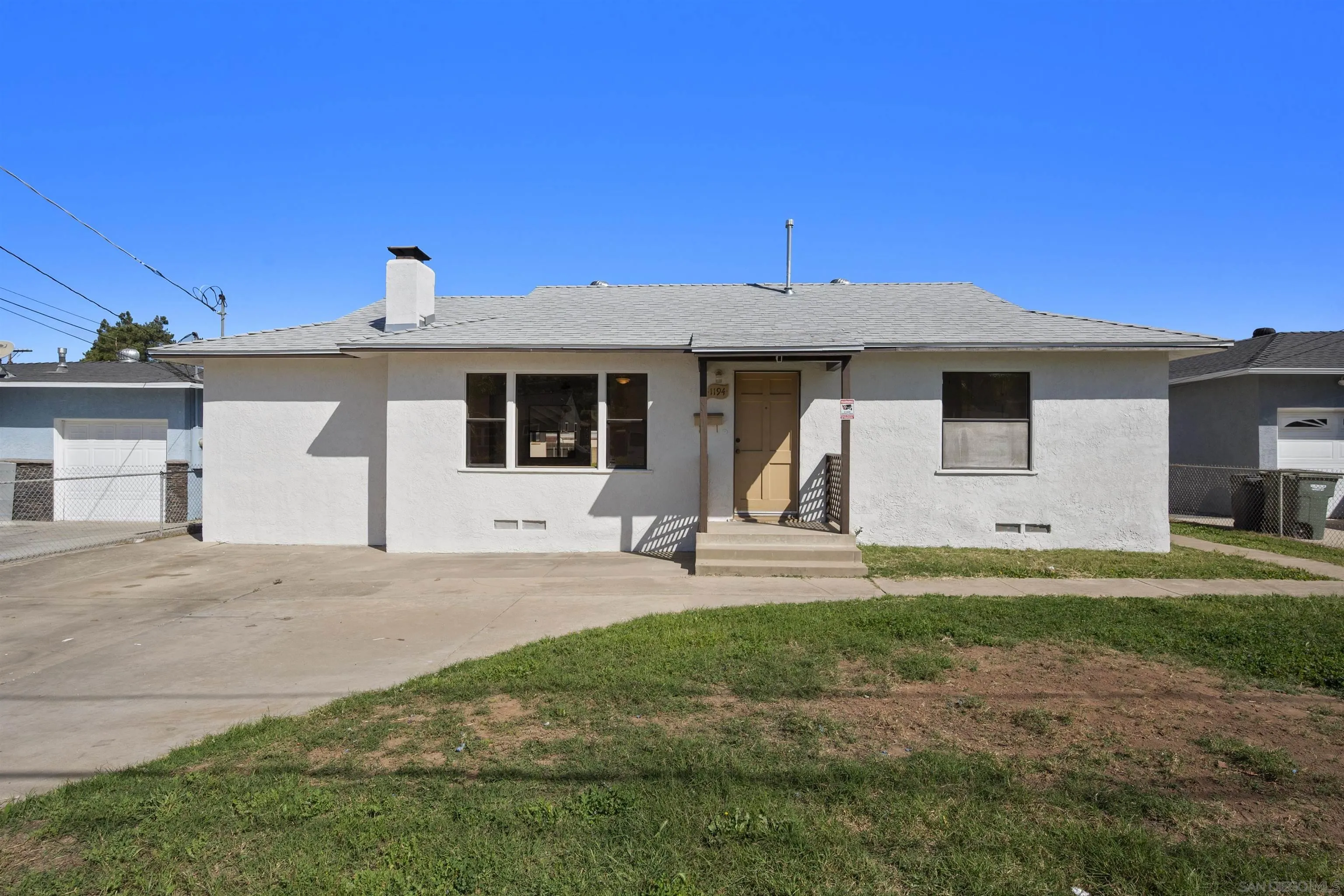 a front view of a house with garage