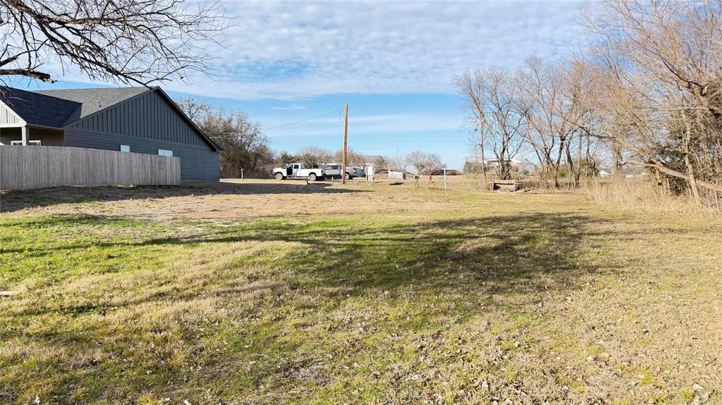 Tbd Maple Street Farmersville, TX 75442 - Photo 2 of 4 a view of a yard with a house