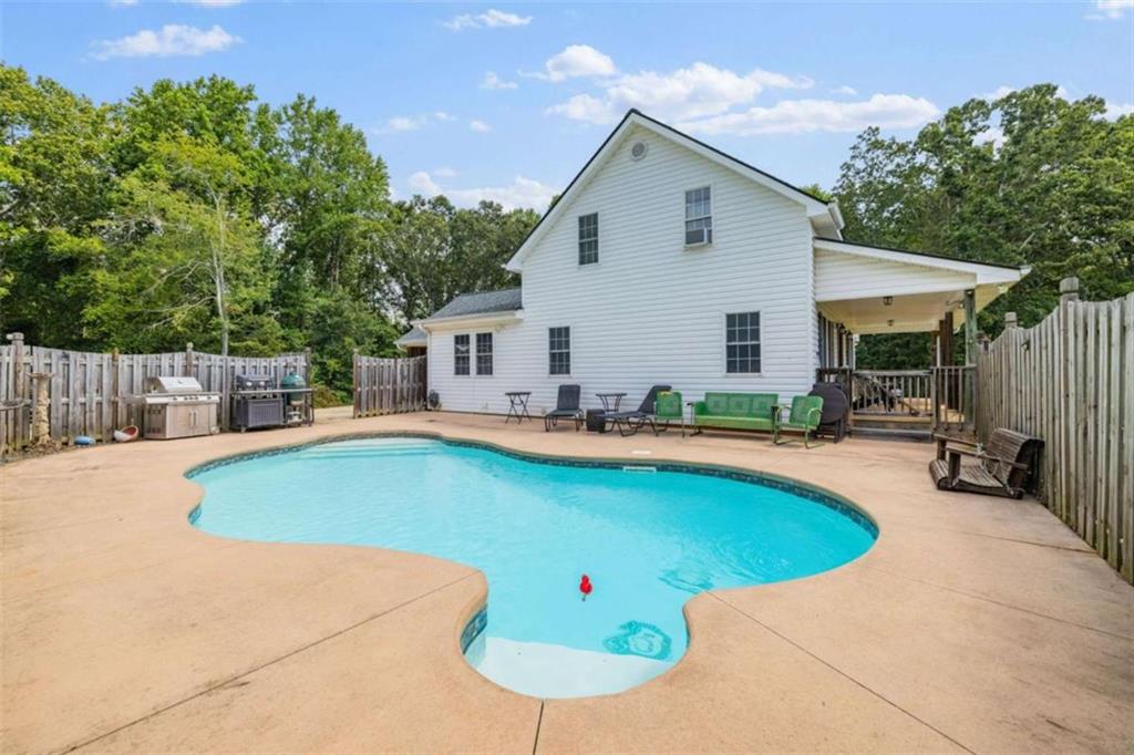 131 Caudell Drive Lula, GA 30554 - Photo 1 of 58 a view of a patio with swimming pool and porch