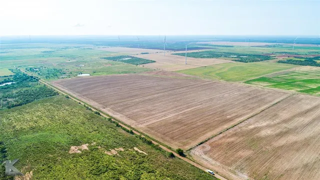 a view of a yard with an ocean view