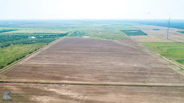 a view of a yard and an ocean view