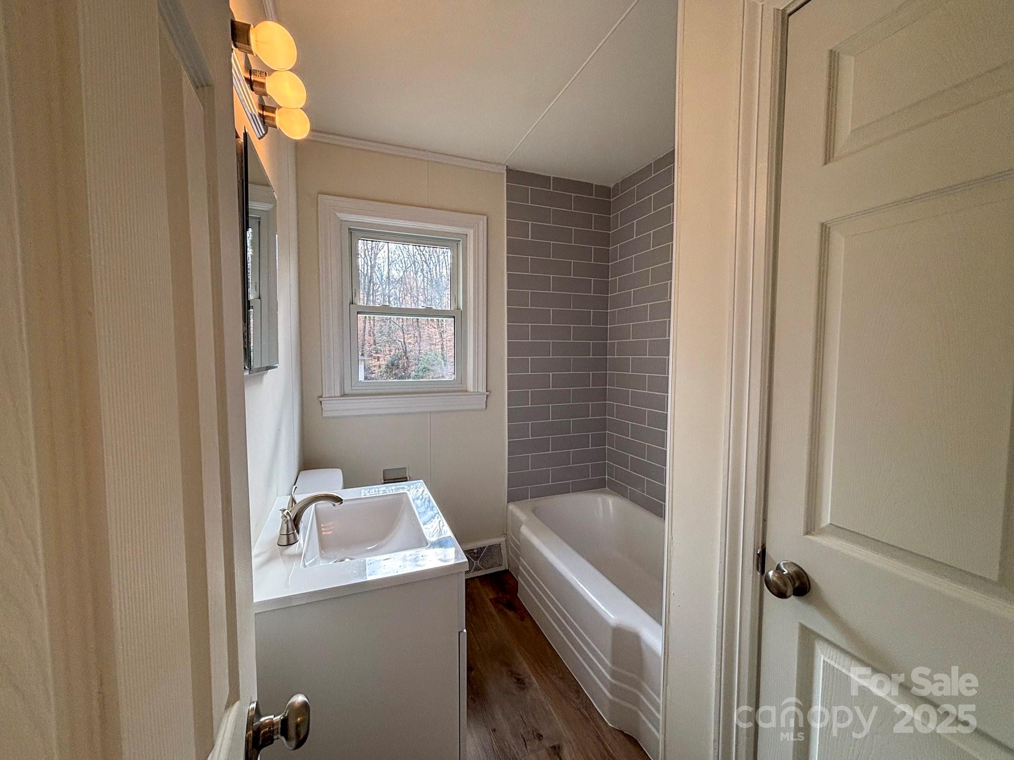 1117 Red Street Kannapolis, NC 28081 - Photo 13 of 48 a bathroom with a bathtub and window