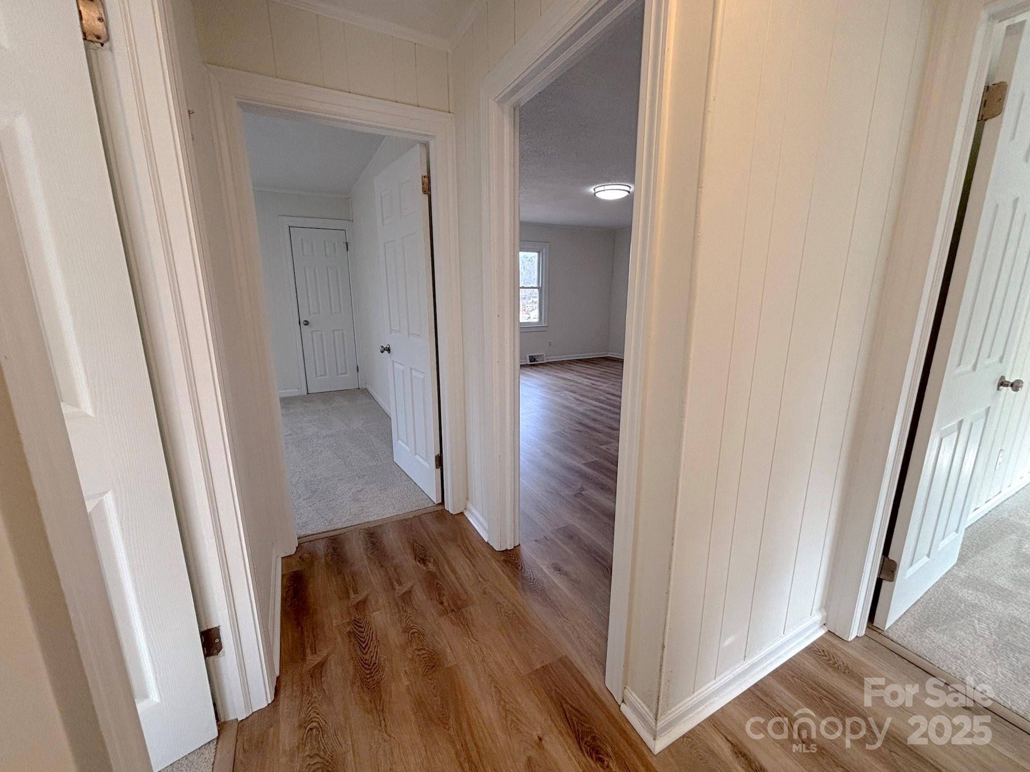 1117 Red Street Kannapolis, NC 28081 - Photo 17 of 48 a view of a hallway with wooden floor and staircase