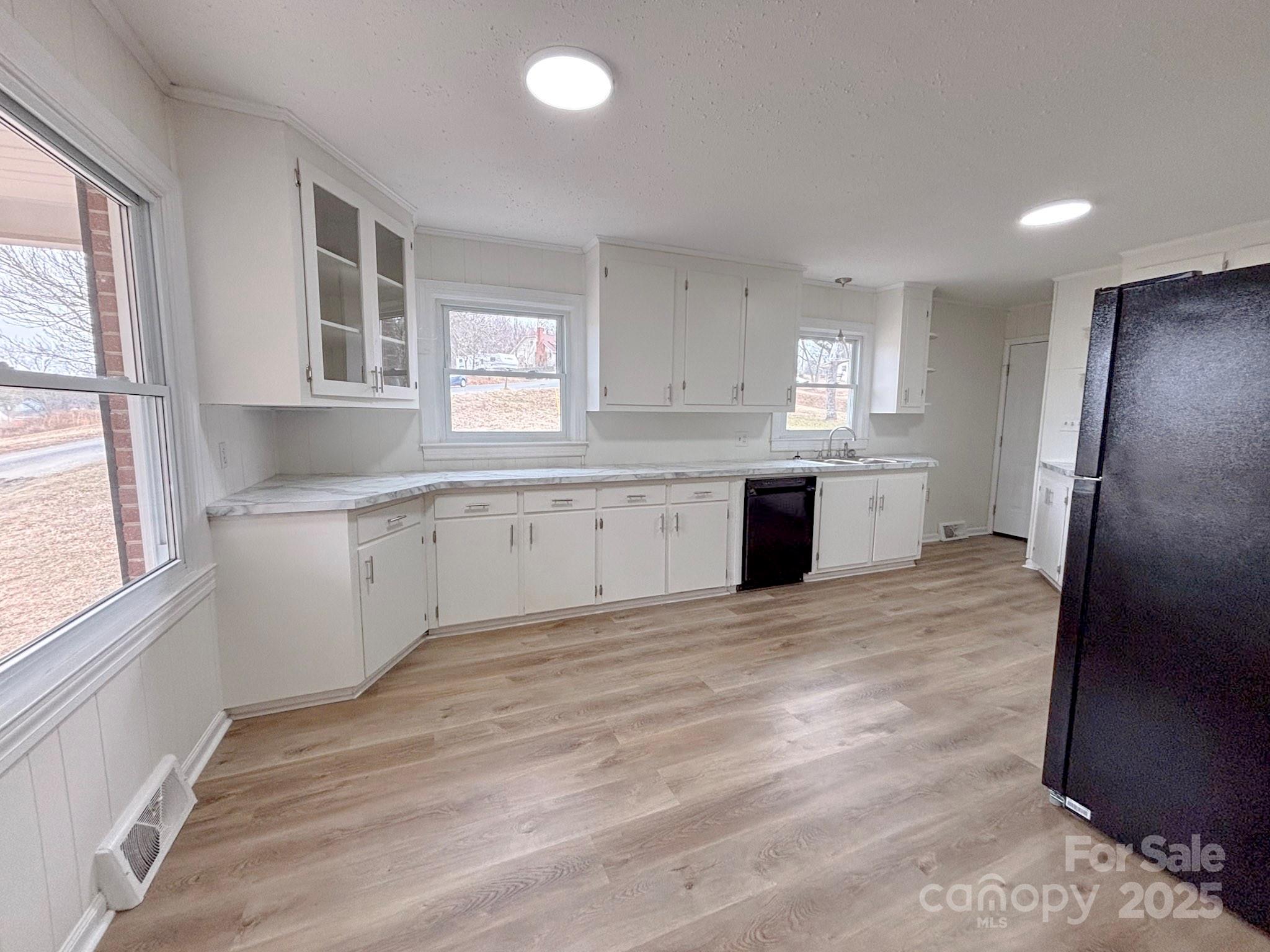 1117 Red Street Kannapolis, NC 28081 - Photo 6 of 48 a large kitchen with stainless steel appliances granite countertop a stove a sink and a refrigerator