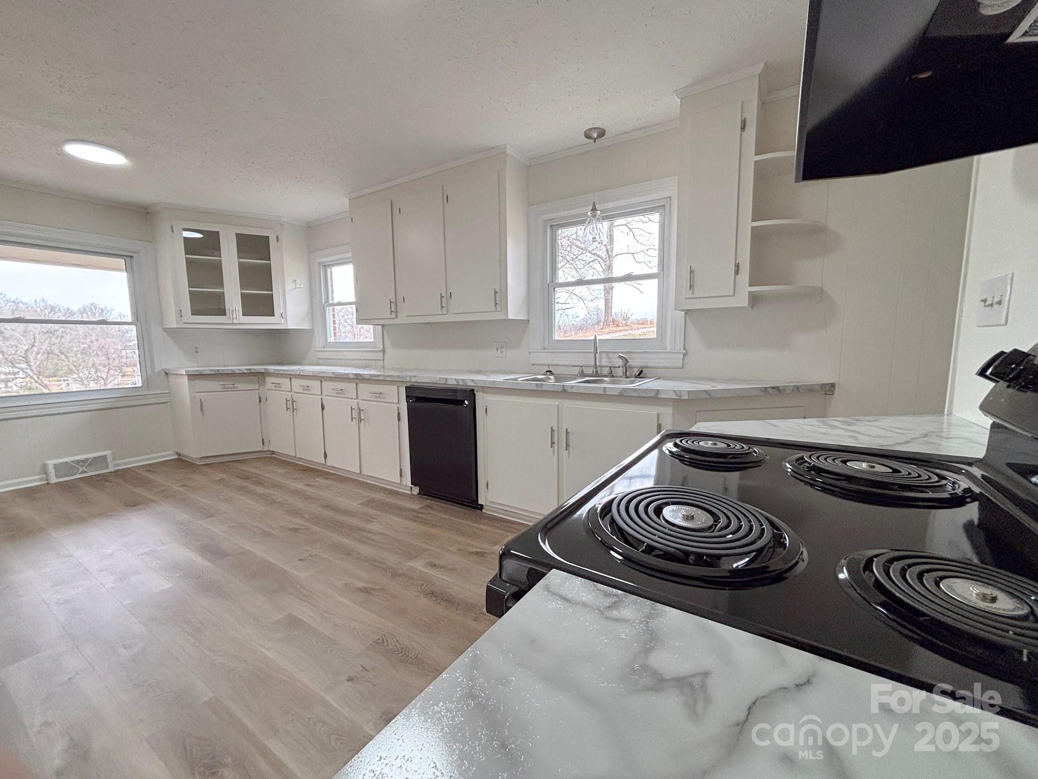 1117 Red Street Kannapolis, NC 28081 - Photo 7 of 48 a kitchen with a stove a sink and a window