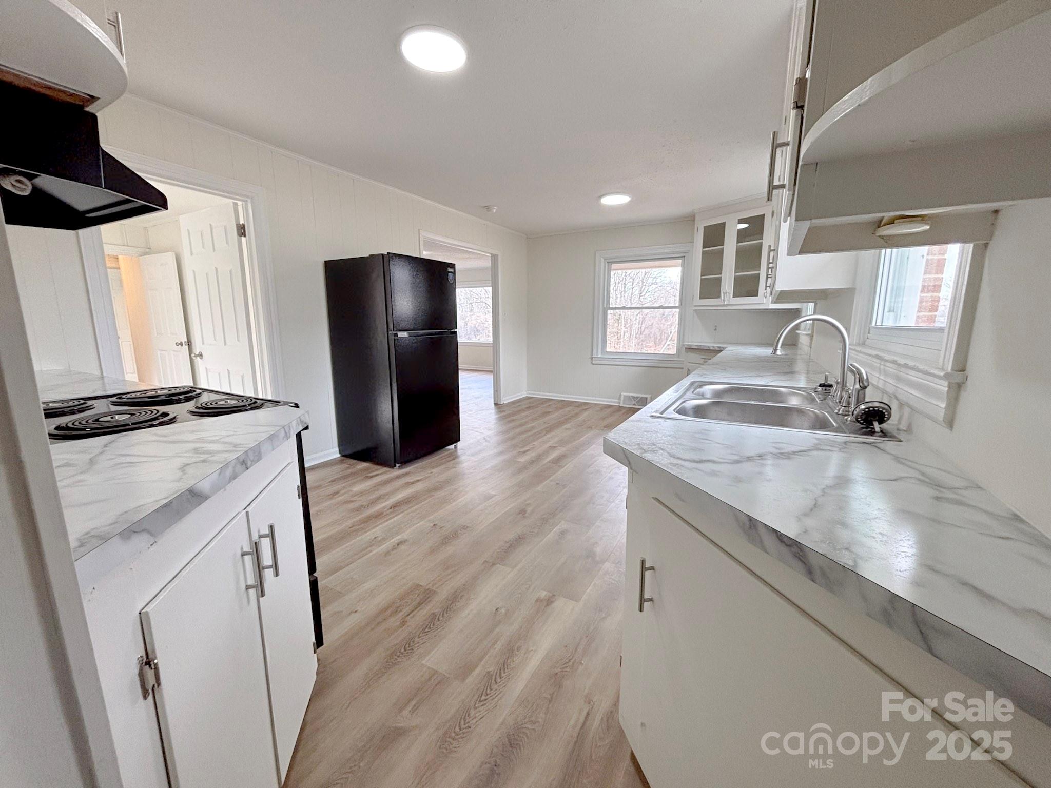 1117 Red Street Kannapolis, NC 28081 - Photo 8 of 48 a kitchen with a sink stove and refrigerator