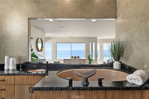 a lobby with furniture and a potted plant