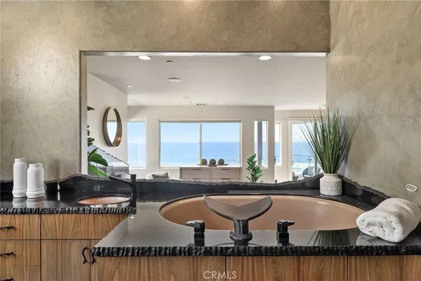 a lobby with furniture and a potted plant