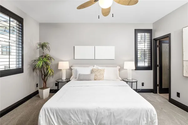 a bedroom with bed and a window