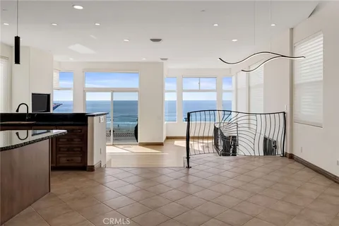 a view of a kitchen with furniture and a window