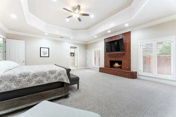 a spacious bedroom with a bed and a couch