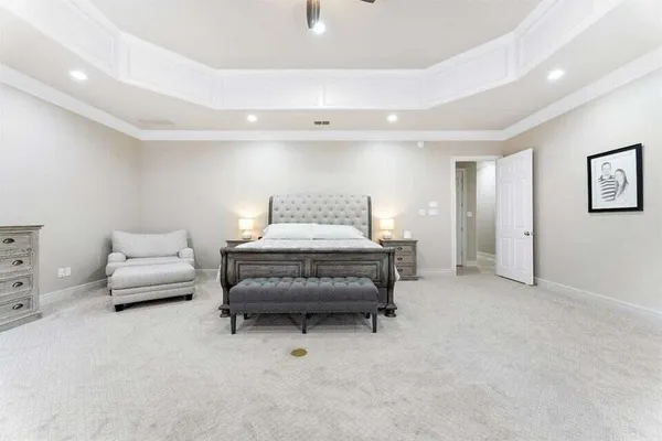 a spacious bathroom with a sink and a mirror