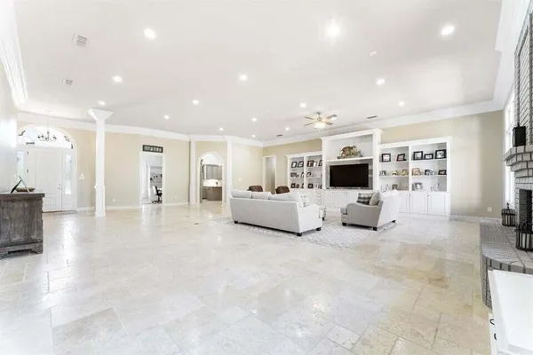 a living room with furniture and white walls