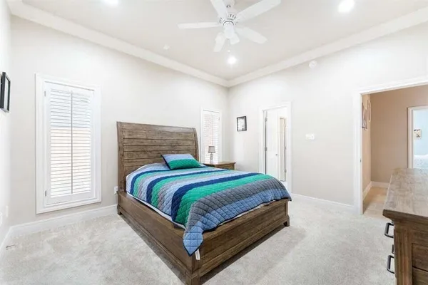 a spacious bathroom with a double vanity sink and a mirror