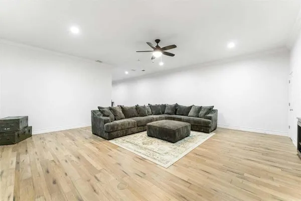 a dining room with a wooden table and chairs