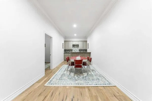 a room with a bed and cabinets