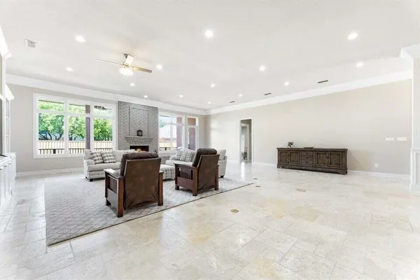 a large kitchen with a table and chairs